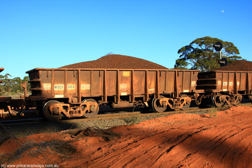 100731 02352
WO type iron ore waggon WO 31204 is one of a batch of eighty six built by WAGR Midland Workshops between 1967 and March 1968 with fleet number 101 for Koolyanobbing iron ore operations with a 75 ton and 1018 ft.³ capacity, on loaded train 6413 at Binduli Triangle, 31st July 2010. This unit was converted to WOS superphosphate in the late 1980s till 1994 when it was re-classed back to WO.
Keywords: WO-type;WO31204;WAGR-Midland-WS;WOS-type;