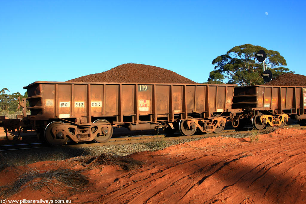 100731 02353
WO type iron ore waggon WO 31224 is one of a batch of eighty six built by WAGR Midland Workshops between 1967 and March 1968 with fleet number 119 for Koolyanobbing iron ore operations, with a 75 ton and 1018 ft³ capacity, on loaded train 6413 at Binduli Triangle, 31st July 2010. This unit was converted to WOC for coal in 1986 till 1994 when it was re-classed back to WO.
Keywords: WO-type;WO31224;WAGR-Midland-WS;