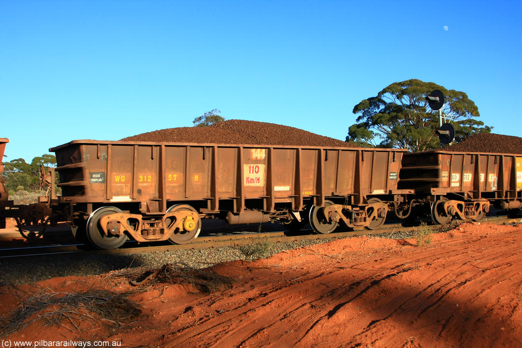 100731 02357
WO type iron ore waggon WO 31257 is one of a batch of eighty six built by WAGR Midland Workshops between 1967 and March 1968 with fleet number 144 for Koolyanobbing iron ore operations, with a 75 ton and 1018 ft³ capacity, on loaded train 6413 at Binduli Triangle, 31st July 2010.
Keywords: WO-type;WO31257;WAGR-Midland-WS;