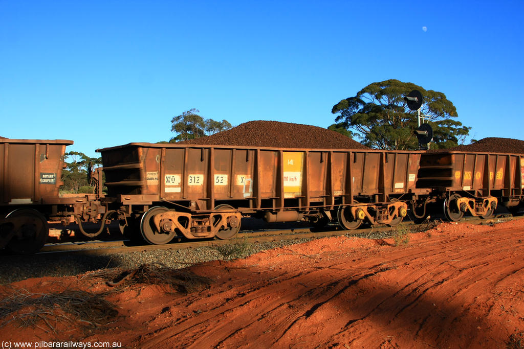 100731 02358
WO type iron ore waggon WO 31252 is one of a batch of eighty six built by WAGR Midland Workshops between 1967 and March 1968 with fleet number 141 for Koolyanobbing iron ore operations, with a 75 ton and 1018 ft³ capacity, on loaded train 6413 at Binduli Triangle, 31st July 2010.
Keywords: WO-type;WO31252;WAGR-Midland-WS;
