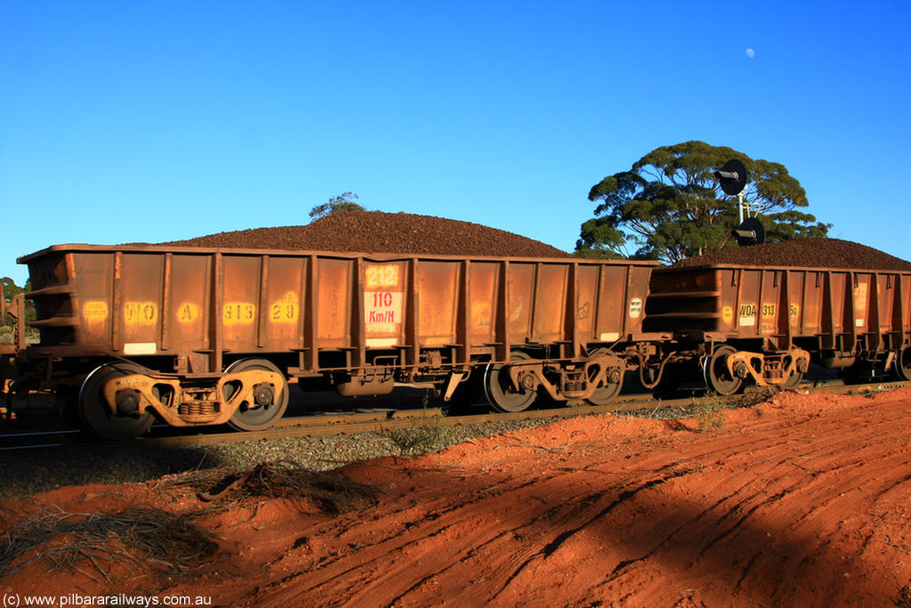 100731 02359
WOA type iron ore waggon WOA 31329 is one of a batch of thirty nine built by WAGR Midland Workshops between 1970 and 1971 with fleet number 212 for Koolyanobbing iron ore operations, with a 75 ton and 1018 ft³ capacity, on loaded train 6413 at Binduli Triangle, 31st July 2010.
Keywords: WOA-type;WOA31329;WAGR-Midland-WS;