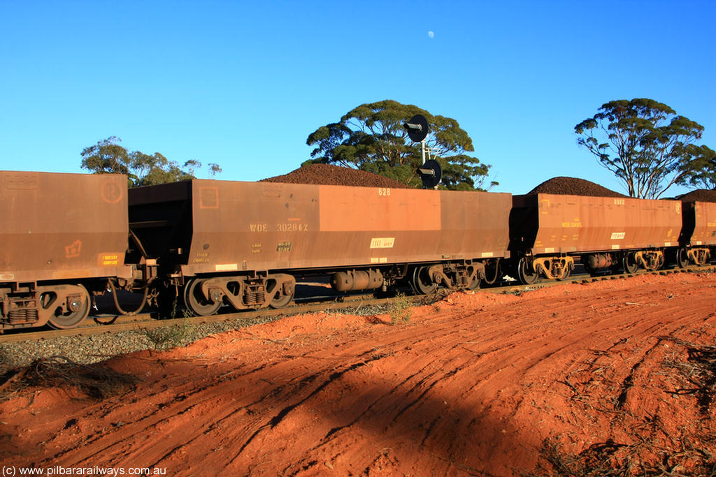 100731 02371
WOE type iron ore waggon WOE 30286 is one of a batch of one hundred and thirty built by Goninan WA between March and August 2001 with serial number 950092-036 and fleet number 628 for Koolyanobbing iron ore operations, on loaded train 6413 at Binduli Triangle, 31st July 2010.
Keywords: WOE-type;WOE30286;Goninan-WA;950092-036;