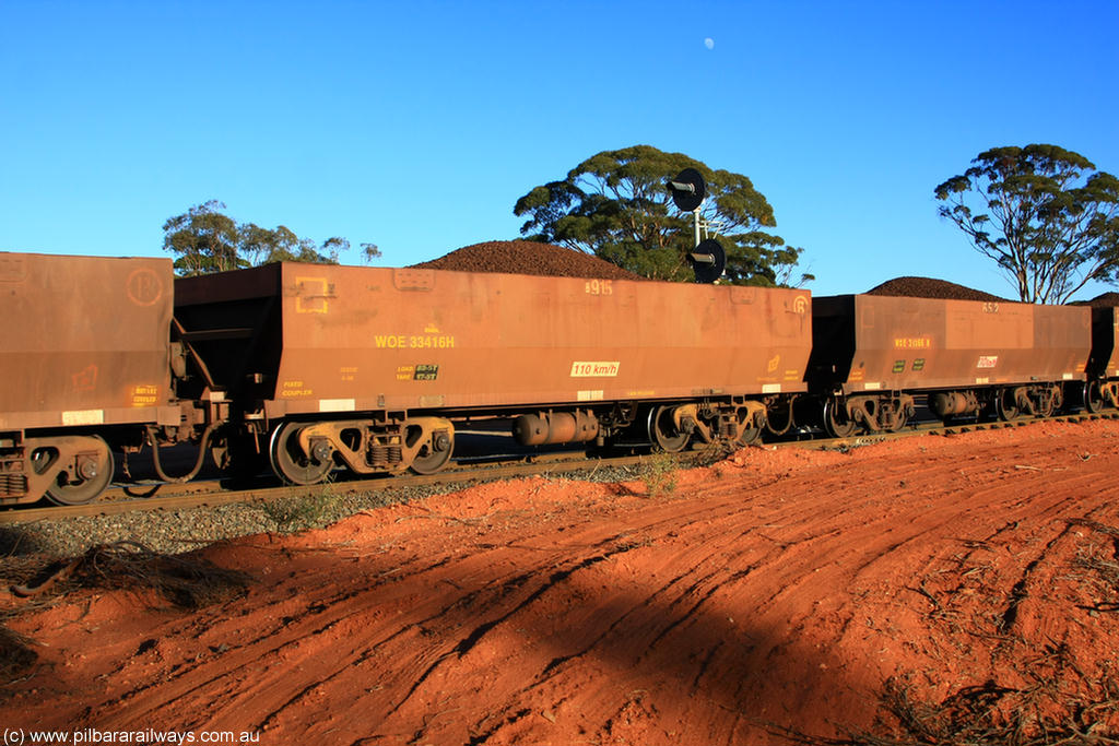100731 02377
WOE type iron ore waggon WOE 33416 is one of a batch of one hundred and forty one built by United Group Rail WA between November 2005 and April 2006 with serial number 950142-121 and fleet number 8915 for Koolyanobbing iron ore operations, on loaded train 6413 at Binduli Triangle, 31st July 2010.
Keywords: WOE-type;WOE33416;United-Group-Rail-WA;950142-121;