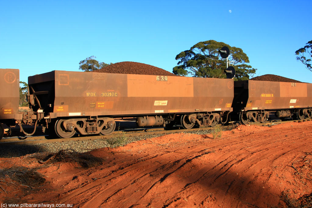 100731 02389
WOE type iron ore waggon WOE 30297 is one of a batch of one hundred and thirty built by Goninan WA between March and August 2001 with serial number 950092-047 and fleet number 639 for Koolyanobbing iron ore operations, on loaded train 6413 at Binduli Triangle, 31st July 2010.
Keywords: WOE-type;WOE30297;Goninan-WA;950092-047;