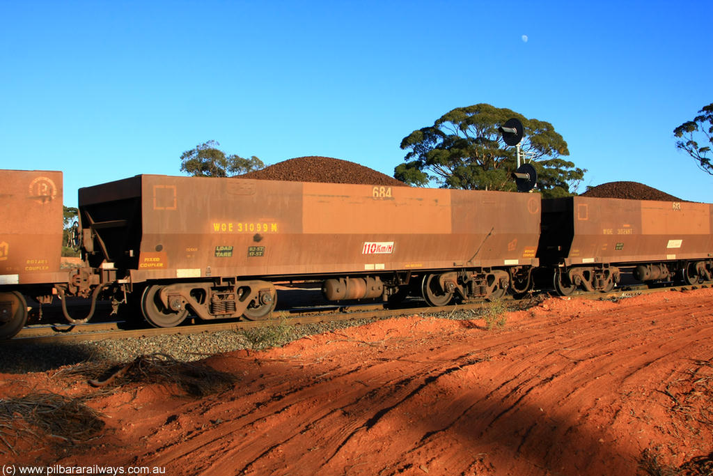 100731 02392
WOE type iron ore waggon WOE 31099 is one of a batch of one hundred and thirty built by Goninan WA between March and August 2001 with serial number 950092-089 and fleet number 684 for Koolyanobbing iron ore operations, on loaded train 6413 at Binduli Triangle, 31st July 2010.
Keywords: WOE-type;WOE31099;Goninan-WA;950092-089;