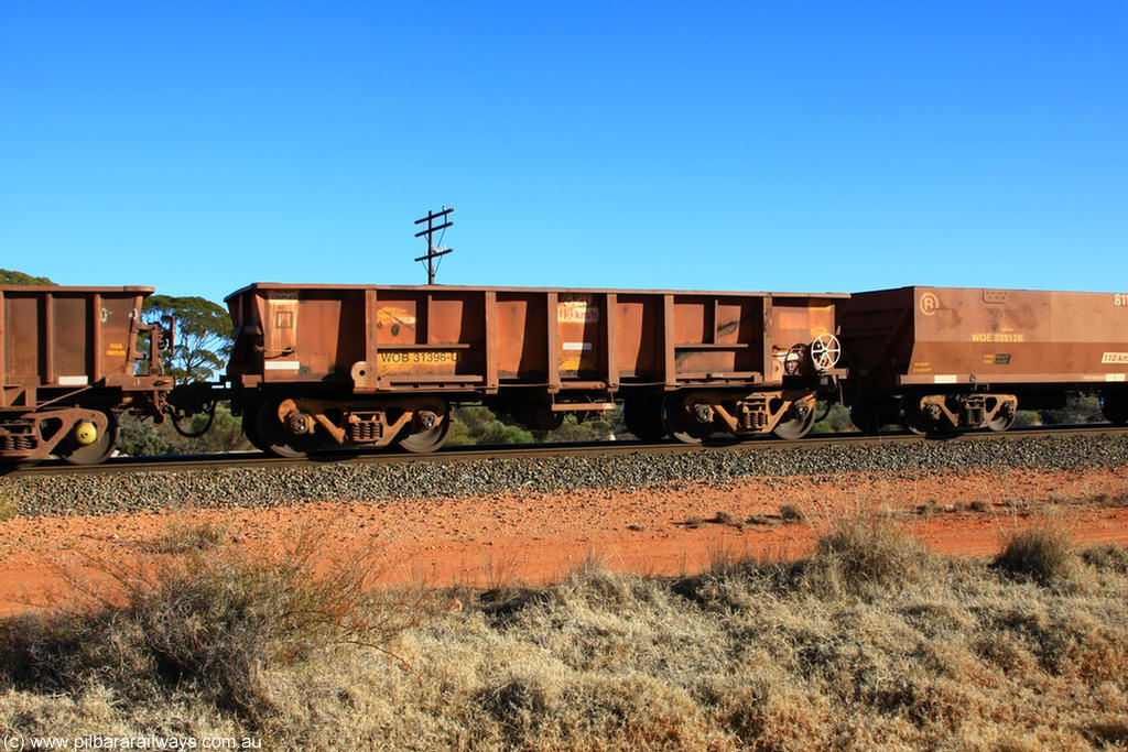 100731 02422
WOB type iron ore waggon WOB 31396 is one of a batch of twenty five built by Comeng WA between 1974 and 1975 and converted from Mt Newman high sided waggons by WAGR Midland Workshops with a capacity of 67 tons with fleet number 320 for Koolyanobbing iron ore operations. This waggon was also converted to a WSM type ballast hopper by re-fitting the cut down top section and having bottom discharge doors fitted, converted back to WOB in 1998, on empty train 6418 at Binduli Triangle, 31st July 2010.
Keywords: WOB-type;WOB31396;Comeng-WA;WSM-type;Mt-Newman-Mining;