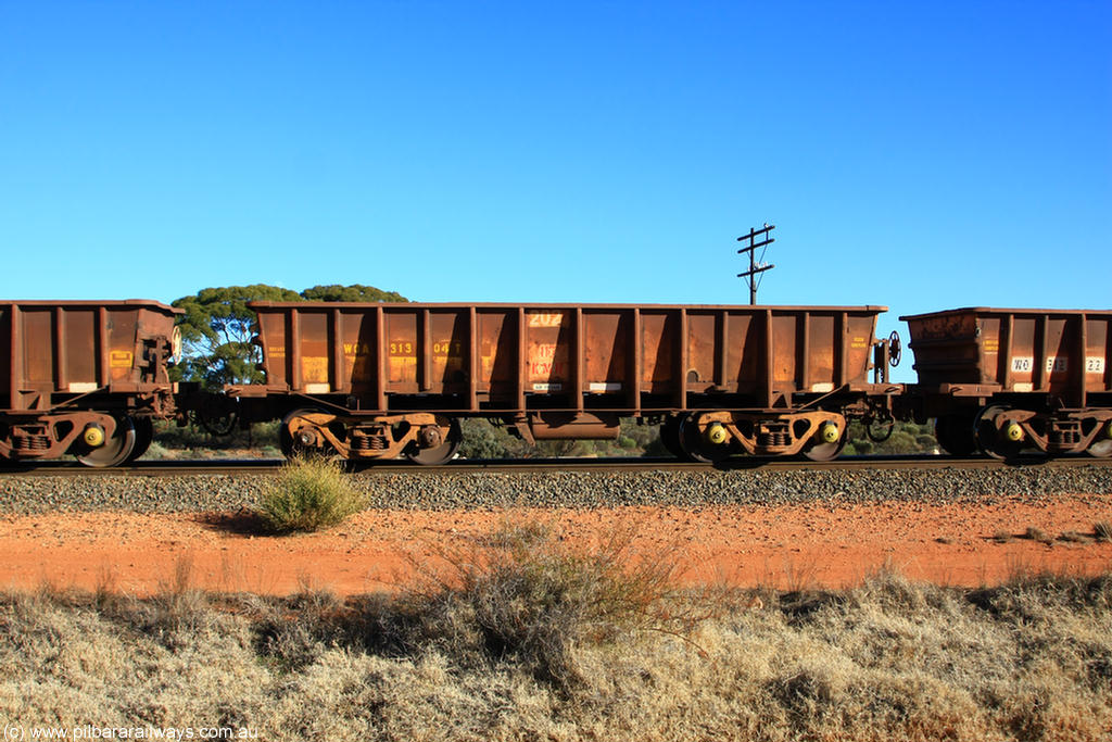 100731 02424
WOA type iron ore waggon WOA 31304 is one of a batch of thirty nine built by WAGR Midland Workshops between 1970 and 1971 with fleet number 202 for Koolyanobbing iron ore operations, with a 75 ton and 1018 ft³ capacity, on empty train 6418 at Binduli Triangle, 31st July 2010.
Keywords: WOA-type;WOA31304;WAGR-Midland-WS;