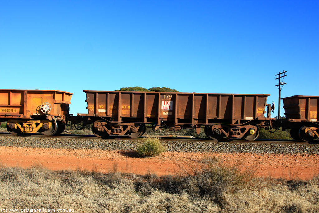 100731 02425
WO type iron ore waggon WO 31301 is one of a batch of fifteen built by WAGR Midland Workshops between July and October 1968 with fleet number 179 for Koolyanobbing iron ore operations, with a 75 ton and 1018 ft³ capacity, on empty train 6418 at Binduli Triangle, 31st July 2010. This unit was converted to WOC for coal in 1986 till 1994 when it was re-classed back to WO.
Keywords: WO-type;WO31301;WAGR-Midland-WS;