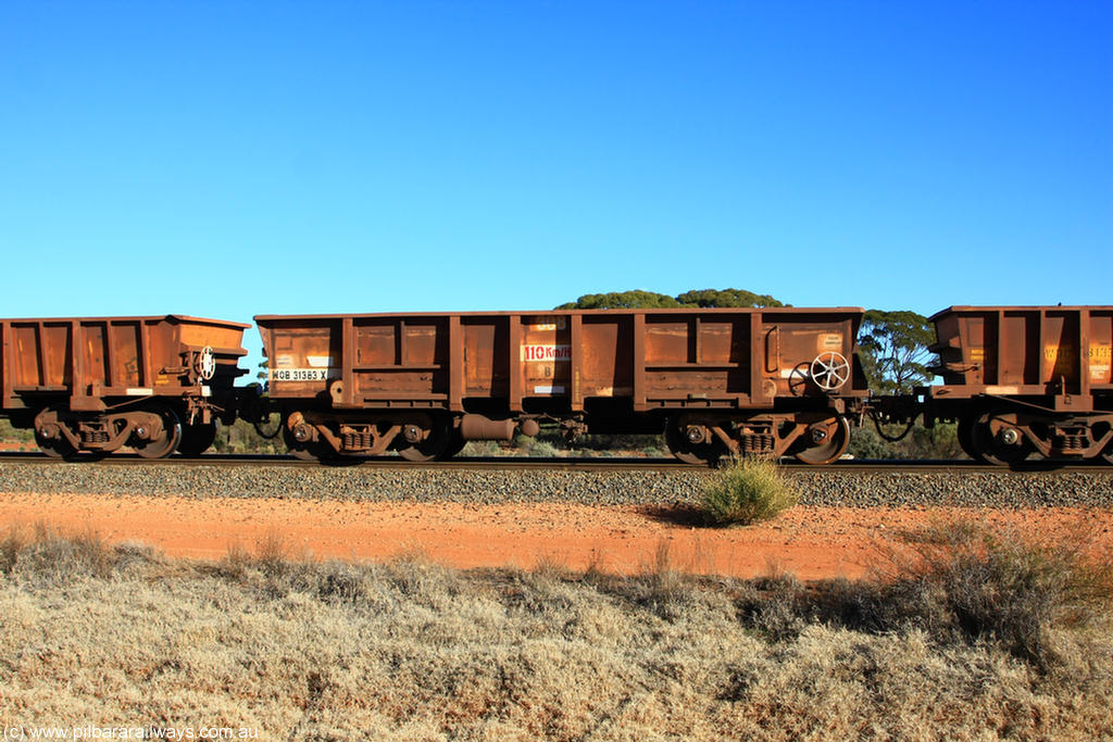 100731 02435
WOB type iron ore waggon WOB 31383 is one of a batch of twenty five built by Comeng WA between 1974 and 1975 and converted from Mt Newman high sided waggons by WAGR Midland Workshops with a capacity of 67 tons with fleet number 308 for Koolyanobbing iron ore operations, on empty train 6418 at Binduli Triangle, 31st July 2010.
Keywords: WOB-type;WOB31383;Comeng-WA;Mt-Newman-Mining;