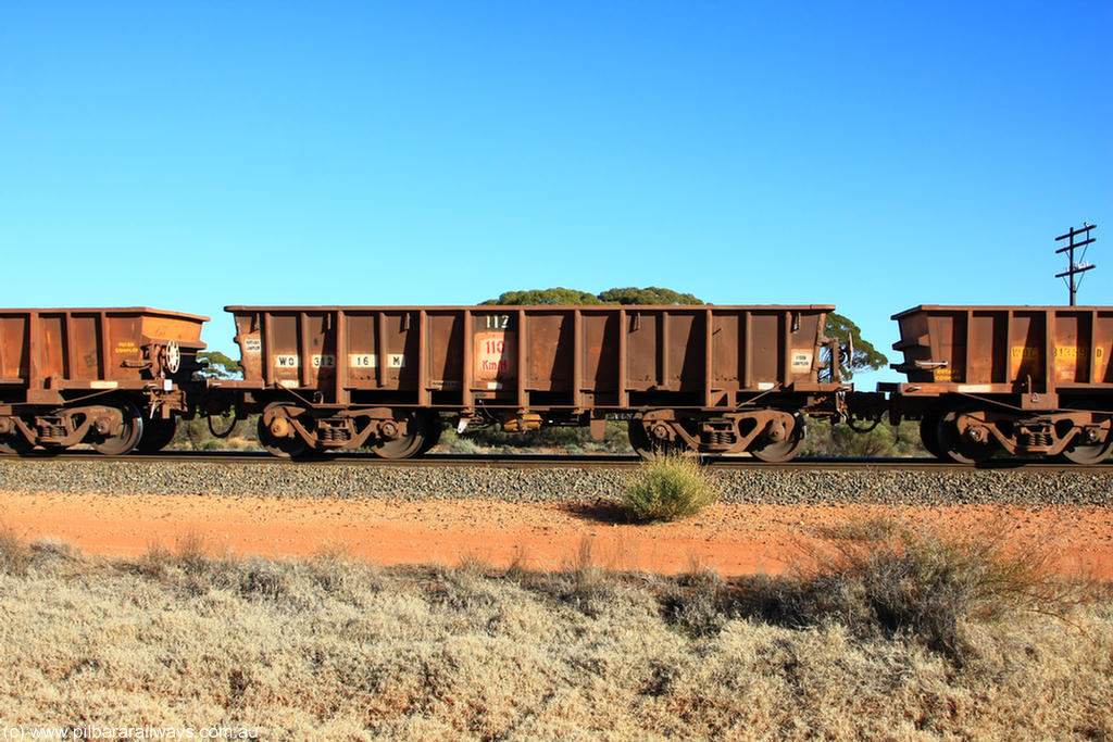 100731 02450
WO type iron ore waggon WO 31216 is one of a batch of eighty six built by WAGR Midland Workshops between 1967 and March 1968 with fleet number 112 for Koolyanobbing iron ore operations, with a 75 ton and 1018 ft³ capacity, on empty train 6418 at Binduli Triangle, 31st July 2010. This unit was converted to WOS superphosphate in the late 1980s till 1994 when it was re-classed back to WO.
Keywords: WO-type;WO31216;WAGR-Midland-WS;WOS-type;