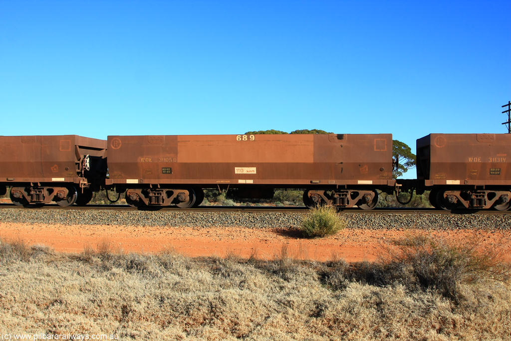 100731 02464
WOE type iron ore waggon WOE 31105 is one of a batch of one hundred and thirty built by Goninan WA between March and August 2001 with serial number 950092-095 and fleet number 689 for Koolyanobbing iron ore operations, on empty train 6418 at Binduli Triangle, 31st July 2010.
Keywords: WOE-type;WOE31105;Goninan-WA;950092-095;
