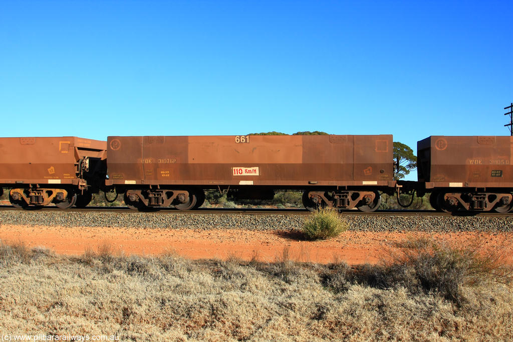 100731 02465
WOE type iron ore waggon WOE 31076 is one of a batch of one hundred and thirty built by Goninan WA between March and August 2001 with serial number 950092-066 and fleet number 661 for Koolyanobbing iron ore operations, on empty train 6418 at Binduli Triangle, 31st July 2010.
Keywords: WOE-type;WOE31076;Goninan-WA;950092-066;