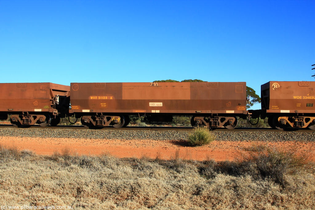 100731 02468
WOE type iron ore waggon WOE 31128 is one of a batch of one hundred and thirty built by Goninan WA between March and August 2001 with serial number 950092-118 and fleet number 710 for Koolyanobbing iron ore operations, on empty train 6418 at Binduli Triangle, 31st July 2010.
Keywords: WOE-type;WOE31128;Goninan-WA;950092-118;