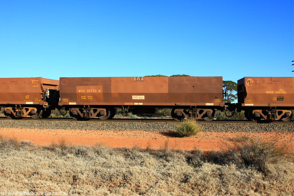 100731 02471
WOE type iron ore waggon WOE 30254 is one of a batch of one hundred and thirty built by Goninan WA between March and August 2001 with serial number 950092-004 and fleet number 604 for Koolyanobbing iron ore operations, on empty train 6418 at Binduli Triangle, 31st July 2010.
Keywords: WOE-type;WOE30254;Goninan-WA;950092-004;