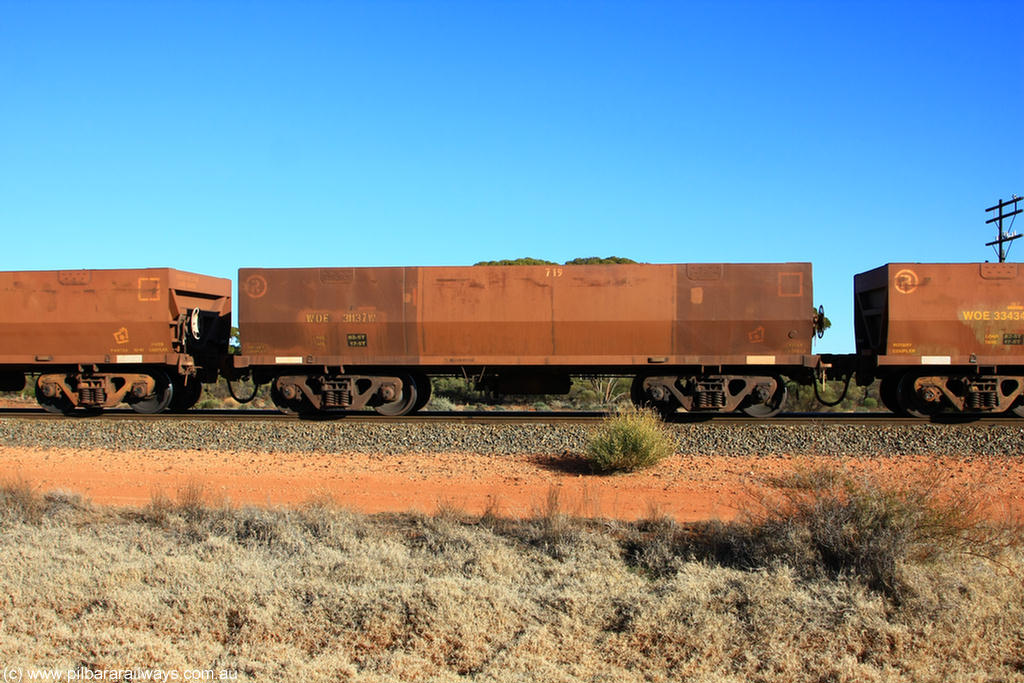 100731 02482
WOE type iron ore waggon WOE 31137 is one of a batch of one hundred and thirty built by Goninan WA between March and August 2001 with serial number 950092-127 and fleet number 719 for Koolyanobbing iron ore operations, on empty train 6418 at Binduli Triangle, 31st July 2010.
Keywords: WOE-type;WOE31137;Goninan-WA;950092-127;