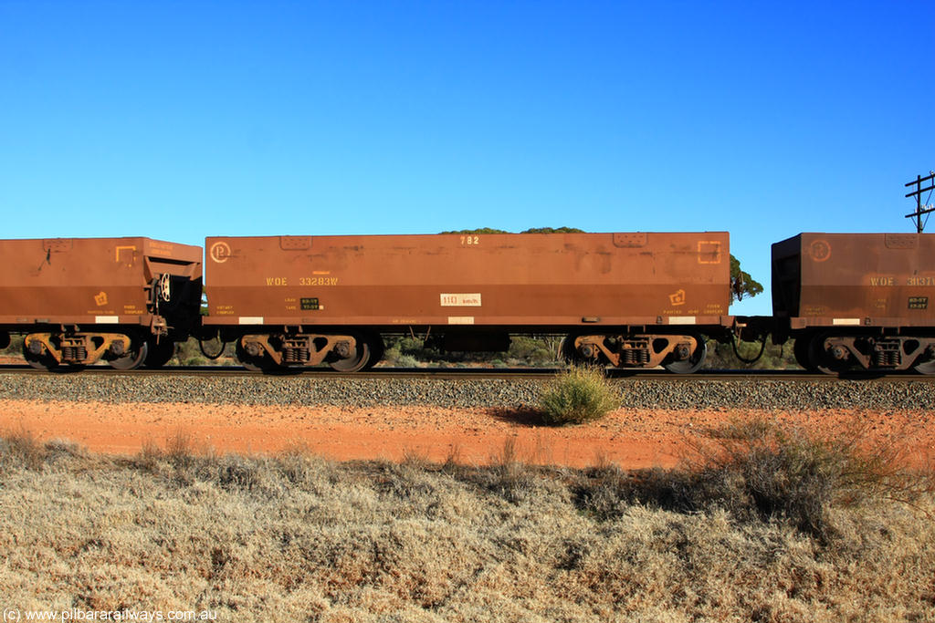 100731 02483
WOE type iron ore waggon WOE 33283 is one of a batch of thirty five built by United Goninan WA between January and April 2005 with serial number 950104-023 and fleet number 782 for Koolyanobbing iron ore operations, on empty train 6418 at Binduli Triangle, 31st July 2010.
Keywords: WOE-type;WOE33283;United-Goninan-WA;950104-023;