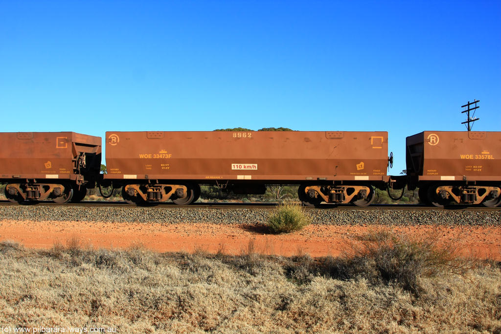 100731 02489
WOE type iron ore waggon WOE 33473 is one of a batch of one hundred and twenty eight built by United Group Rail WA between August 2008 and March 2009 with serial number 950211-015 and fleet number 8962 for Koolyanobbing iron ore operations, on empty train 6418 at Binduli Triangle, 31st July 2010.
Keywords: WOE-type;WOE33473;United-Group-Rail-WA;950211-015;