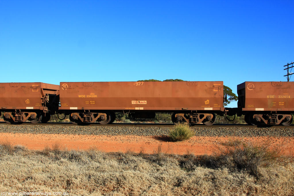 100731 02492
WOE type iron ore waggon WOE 33428 is one of a batch of one hundred and forty one built by United Group Rail WA between November 2005 and April 2006 with serial number 950142-133 and fleet number 8927 for Koolyanobbing iron ore operations, on empty train 6418 at Binduli Triangle, 31st July 2010.
Keywords: WOE-type;WOE33428;United-Group-Rail-WA;950142-133;