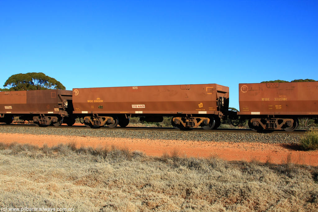 100731 02499
WOE type iron ore waggon WOE 33530 is one of a batch of one hundred and twenty eight built by United Group Rail WA between August 2008 and March 2009 with serial number 950211-070 and fleet number 9015 for Koolyanobbing iron ore operations, on empty train 6418 at Binduli Triangle, 31st July 2010.
Keywords: WOE-type;WOE33530;United-Group-Rail-WA;950211-070;