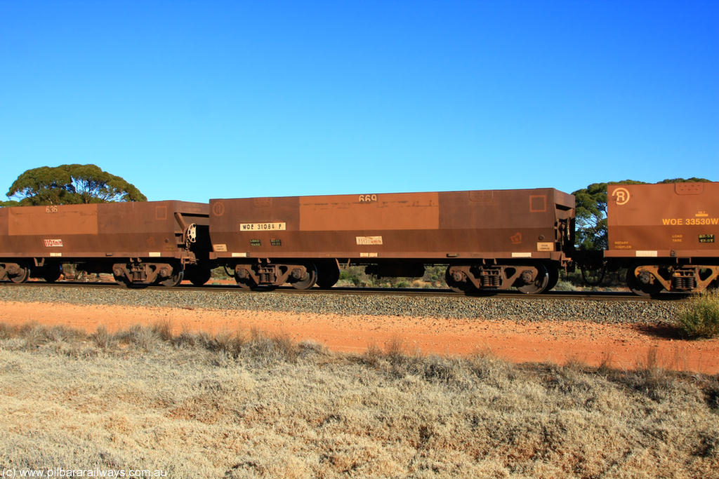100731 02500
WOE type iron ore waggon WOE 31084 is one of a batch of one hundred and thirty built by Goninan WA between March and August 2001 with serial number 950092-074 and fleet number 669 for Koolyanobbing iron ore operations, on empty train 6418 at Binduli Triangle, 31st July 2010.
Keywords: WOE-type;WOE31084;Goninan-WA;950092-074;