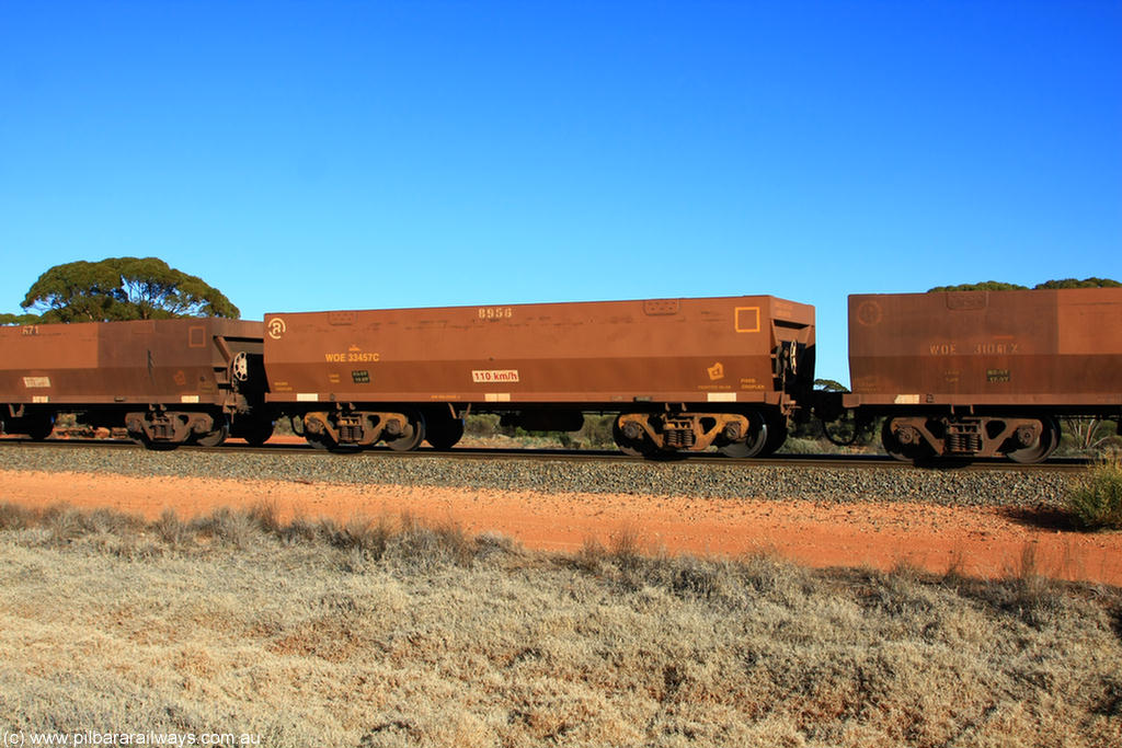 100731 02503
WOE type iron ore waggon WOE 33457 is one of a batch of five built by United Group Rail WA between August and September 2008 with serial number 950210-004 and fleet number 8956 for Koolyanobbing iron ore operations, on empty train 6418 at Binduli Triangle, 31st July 2010.
Keywords: WOE-type;WOE33457;United-Group-Rail-WA;950210-004;