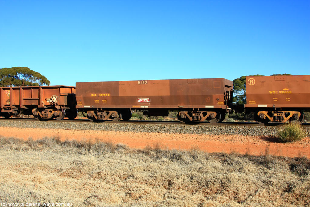 100731 02522
WOE type iron ore waggon WOE 30252 is one of a batch of one hundred and thirty built by Goninan WA between March and August 2001 with serial number 950092-002 and fleet number 602 for Koolyanobbing iron ore operations with a built date April 2001 in the current style of 83 tonne load capacity WOE type waggon built for Portman Mining on Koolyanobbing iron ore train service, on empty train 6418 at Binduli Triangle, 31st July 2010.
Keywords: WOE-type;WOE30252;Goninan-WA;950092-002;