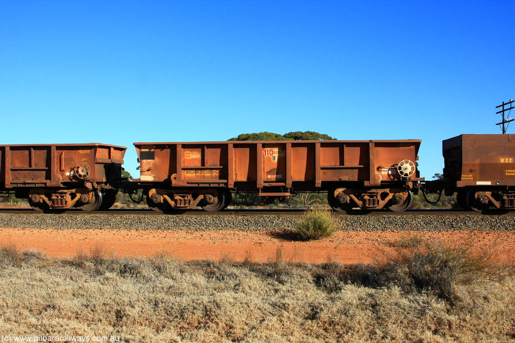 100731 02523
WOB type iron ore waggon WOB 31389 is one of a batch of twenty five built by Comeng WA between 1974 and 1975 and converted from Mt Newman high sided waggons by WAGR Midland Workshops with a capacity of 67 tons with fleet number 314 for Koolyanobbing iron ore operations. This waggon was also converted to a WSM type ballast hopper by re-fitting the cut down top section and having bottom discharge doors fitted, converted back to WOB in 1998, on empty train 6418 at Binduli Triangle, 31st July 2010.
Keywords: WOB-type;WOB31389;Comeng-WA;WSM-type;Mt-Newman-Mining;