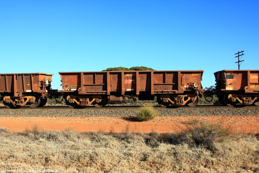 100731 02524
WOB type iron ore waggon WOB 31381 is one of a batch of twenty five built by Comeng WA between 1974 and 1975 and converted from Mt Newman high sided waggons by WAGR Midland Workshops with a capacity of 67 tons with fleet number 306 for Koolyanobbing iron ore operations, on empty train 6418 at Binduli Triangle, 31st July 2010.
Keywords: WOB-type;WOB31381;Comeng-WA;Mt-Newman-Mining;