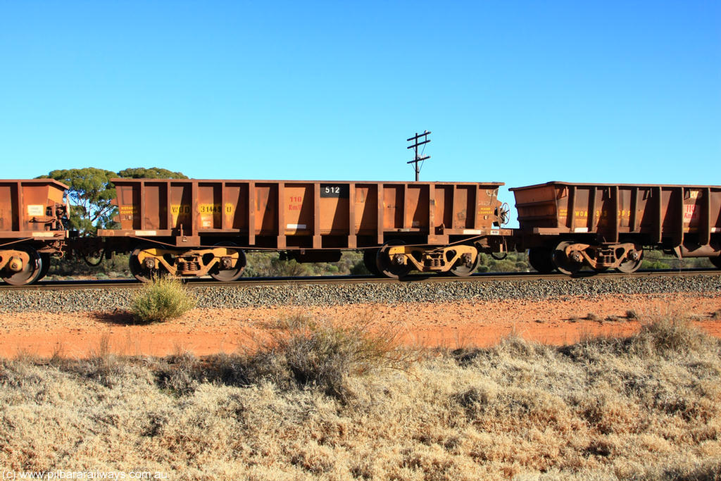 100731 02527
WOD type iron ore waggon WOD 31449 is one of a batch of sixty two built by Goninan WA between April and August 2000 with serial number 950086-021 and fleet number 512 for Koolyanobbing iron ore operations with a 75 ton capacity for Portman Mining to cart their Koolyanobbing iron ore to Esperance, now with PORTMAN painted out, on empty train 6418 at Binduli Triangle, 31st July 2010.
Keywords: WOD-type;WOD31449;Goninan-WA;950086-021;