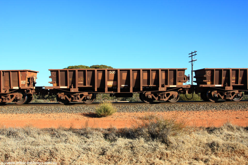100731 02530
WOD type iron ore waggon WOD 31472 is one of a batch of sixty two built by Goninan WA between April and August 2000 with serial number 950086-044 and fleet number 535 for Koolyanobbing iron ore operations with a 75 ton capacity for Portman Mining to cart their Koolyanobbing iron ore to Esperance, now with PORTMAN painted out, on empty train 6418 at Binduli Triangle, 31st July 2010.
Keywords: WOD-type;WOD31472;Goninan-WA;950086-044;