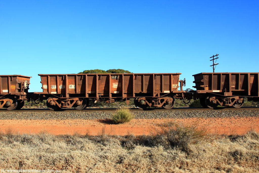 100731 02531
WO type iron ore waggon WO 31291 is one of a batch of fifteen built by WAGR Midland Workshops between July and October 1968 with fleet number 170 for Koolyanobbing iron ore operations, with a 75 ton and 1018 ft³ capacity, on empty train 6418 at Binduli Triangle, 31st July 2010.
Keywords: WO-type;WO31291;WAGR-Midland-WS;