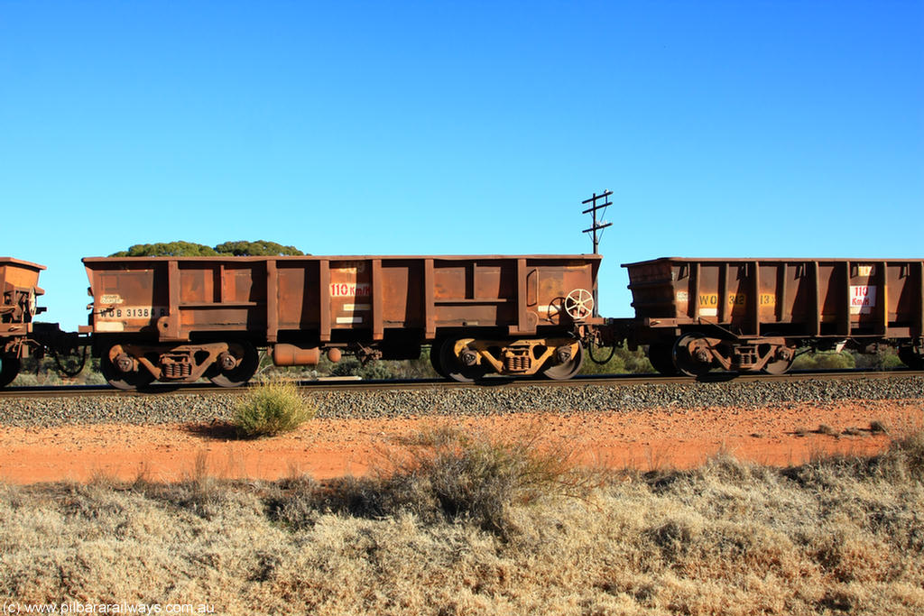 100731 02533
WOB type iron ore waggon WOB 31384 is one of a batch of twenty five built by Comeng WA between 1974 and 1975 and converted from Mt Newman high sided waggons by WAGR Midland Workshops with a capacity of 67 tons with fleet number 309 for Koolyanobbing iron ore operations, on empty train 6418 at Binduli Triangle, 31st July 2010.
Keywords: WOB-type;WOB31384;Comeng-WA;Mt-Newman-Mining;