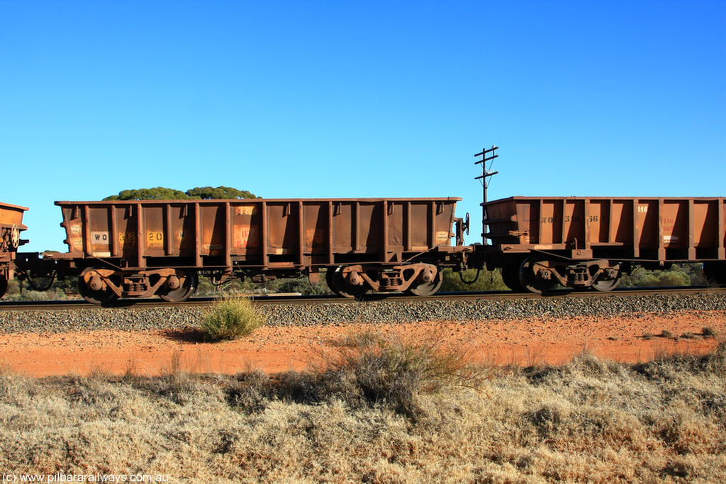 100731 02535
WO type iron ore waggon WO 31220 is one of a batch of eighty six built by WAGR Midland Workshops between 1967 and March 1968 with fleet number 115 for Koolyanobbing iron ore operations, with a 75 ton and 1018 ft³ capacity, on empty train 6418 at Binduli Triangle, 31st July 2010.
Keywords: WO-type;WO31220;WAGR-Midland-WS;