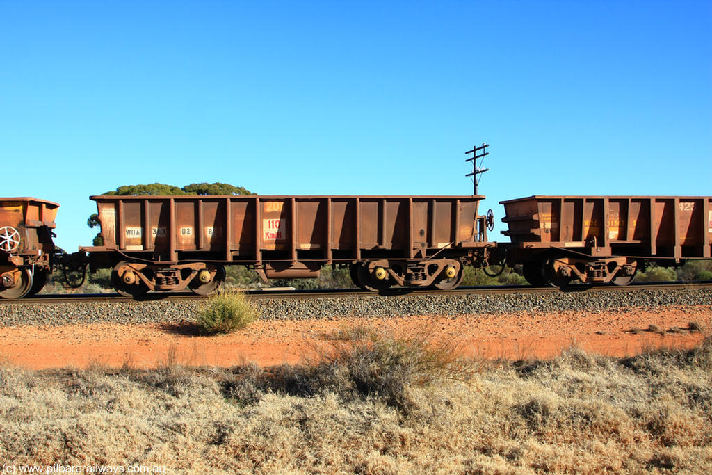 100731 02539
WOA type iron ore waggon WOA 31302 is leader of a batch of thirty nine built by WAGR Midland Workshops between 1970 and 1971 with fleet number 201 for Koolyanobbing iron ore operations, with a 75 ton and 1018 ft³ capacity, on empty train 6418 at Binduli Triangle, 31st July 2010.
Keywords: WOA-type;WOA31302;WAGR-Midland-WS;type-leader;