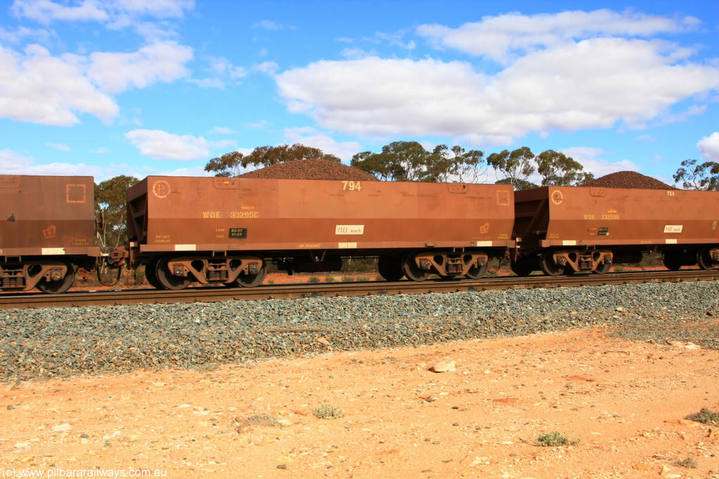 100731 02826
WOE type iron ore waggon WOE 33295 is the final one of a batch of thirty five built by United Goninan WA between January and April 2005 with serial number 950104-035 and fleet number 794 for Koolyanobbing iron ore operations, on loaded train 7415 at Binduli Triangle, 31st July 2010.
Keywords: WOE-type;WOE33295;United-Goninan-WA;950104-035;