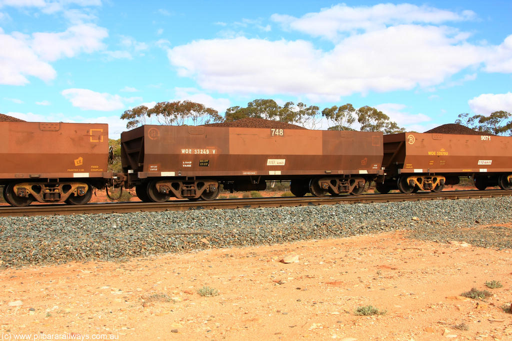 100731 02840
WOE type iron ore waggon WOE 33249 is one of a batch of twenty seven built by Goninan WA between September and October 2002 with serial number 950103-016 and fleet number 748 for Koolyanobbing iron ore operations, on loaded train 7415 at Binduli Triangle, 31st July 2010.
Keywords: WOE-type;WOE33249;Goninan-WA;950103-016;