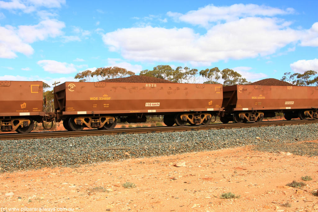 100731 02844
WOE type iron ore waggon WOE 33469 is one of a batch of one hundred and twenty eight built by United Group Rail WA between August 2008 and March 2009 with serial number 950211-011 and fleet number 8978 for Koolyanobbing iron ore operations, on loaded train 7415 at Binduli Triangle, 31st July 2010.
Keywords: WOE-type;WOE33469;United-Group-Rail-WA;950211-011;