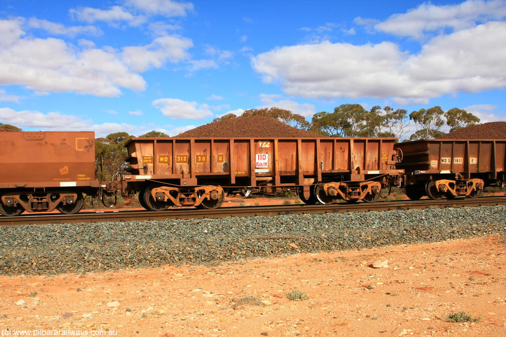 100731 02848
WO type iron ore waggon WO 31230 is one of a batch of sixty two built by Goninan WA between April and August 2000 with serial number 950086-004 and fleet number 122 for Koolyanobbing iron ore operations, and is a Goninan built replacement WO type waggon that replaces the original WAGR built WO type waggon with the newer style WOD type and has square features opposed to the curved ones as on the original WO class, on loaded train 7415 at Binduli Triangle, 31st July 2010.
Keywords: WO-type;WO31230;Goninan-WA;950086-004;