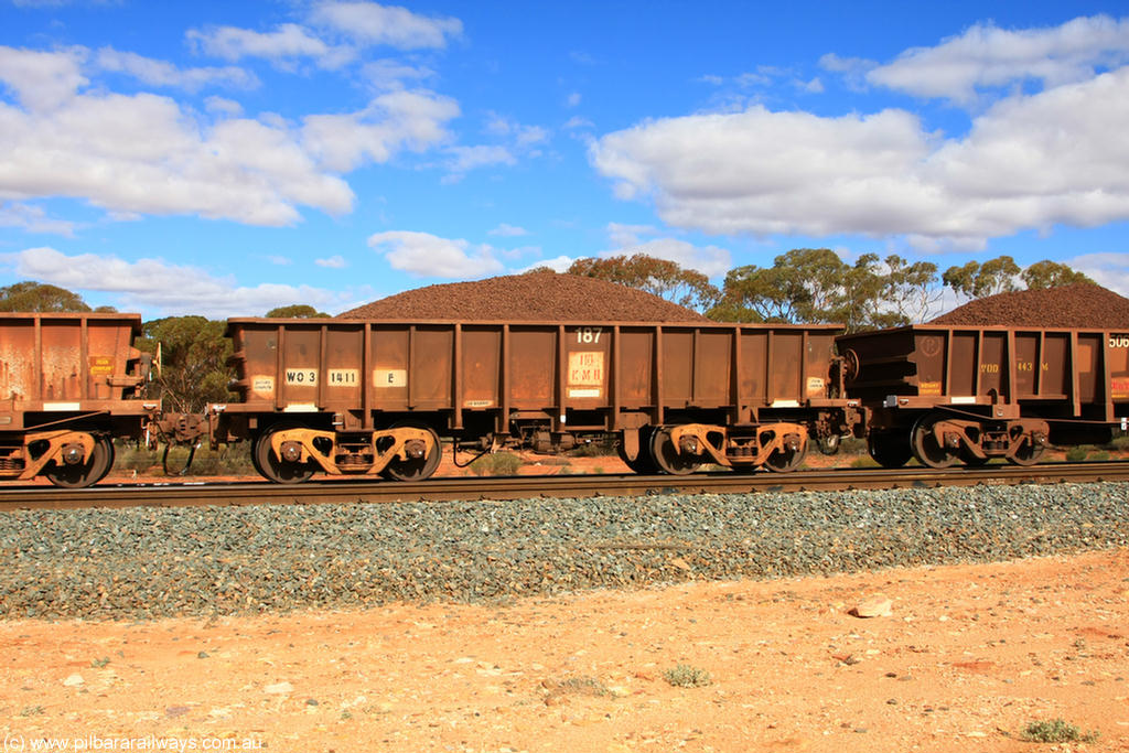 100731 02849
WO type iron ore waggon WO 31411 is one of a batch of eleven replacement waggons built by WAGR Midland Workshops between 1970 and 1971 with fleet number 187 for Koolyanobbing iron ore operations, with a 75 ton and 1018 ft³ capacity, on loaded train 7415 at Binduli Triangle, 31st July 2010. This unit was converted to WOC for coal in 1986 till 1994 when it was re-classed back to WO.
Keywords: WO-type;WO31411;WAGR-Midland-WS;