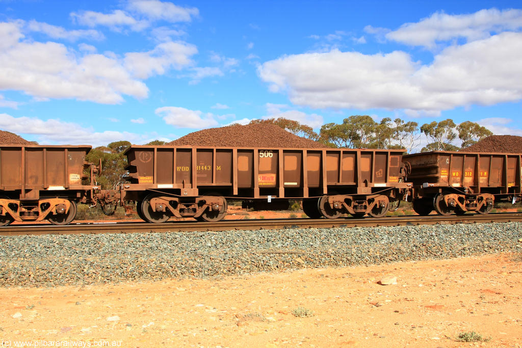 100731 02850
WOD type iron ore waggon WOD 31443 is one of a batch of sixty two built by Goninan WA between April and August 2000 with serial number 950086-016 and fleet number 506 for Koolyanobbing iron ore operations, build date 05/2000, with a 75 ton capacity, for Portman Mining to cart their Koolyanobbing iron ore to Esperance, now with PORTMAN painted out, on loaded train 7415 at Binduli Triangle, 31st July 2010.
Keywords: WOD-type;WOD31443;Goninan-WA;950086-016;