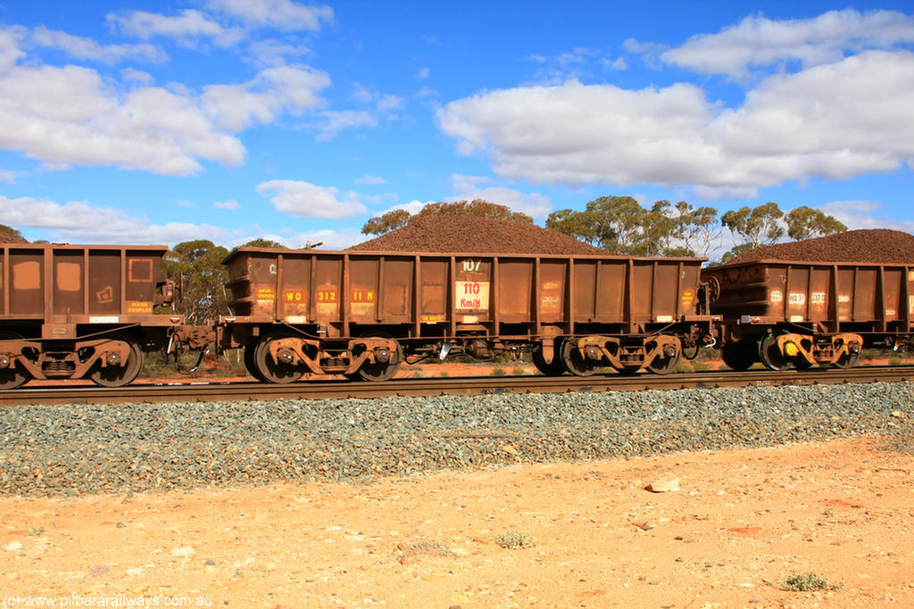 100731 02851
WO type iron ore waggon WO 31211 is one of a batch of eighty six built by WAGR Midland Workshops between 1967 and March 1968 with fleet number 107 for Koolyanobbing iron ore operations, with a 75 ton and 1018 ft³ capacity, on loaded train 7415 at Binduli Triangle, 31st July 2010. This unit was converted to WOC for coal in 1986 till 1994 when it was re-classed back to WO.
Keywords: WO-type;WO31211;WAGR-Midland-WS;
