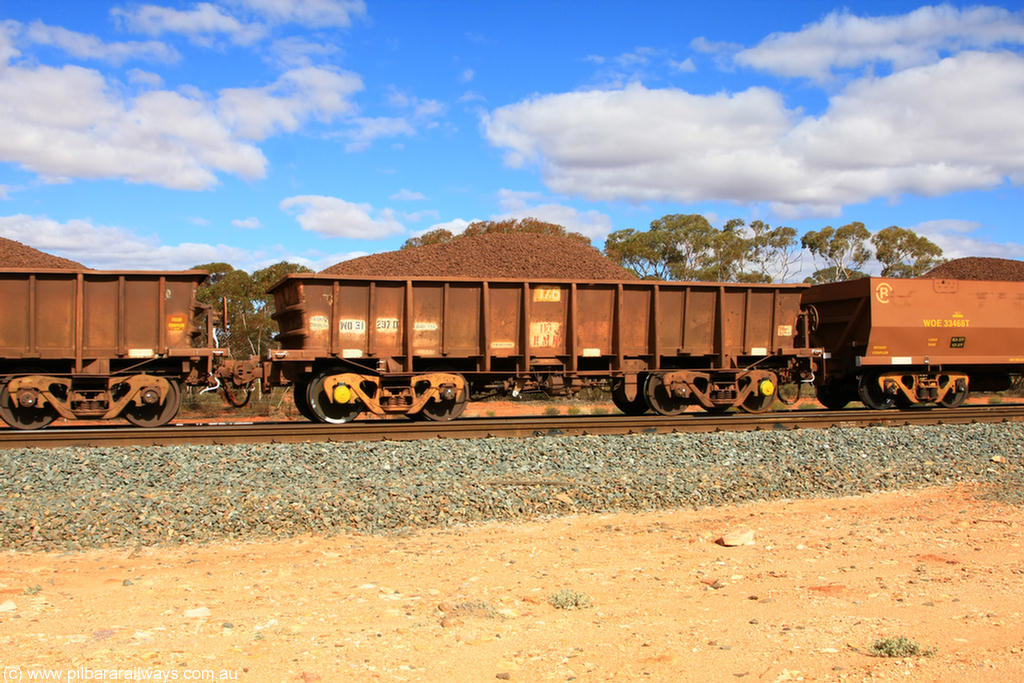 100731 02852
WO type iron ore waggon WO 31297 is one of a batch of fifteen built by WAGR Midland Workshops between July and October 1968 with fleet number 176 for Koolyanobbing iron ore operations, with a 75 ton and 1018 ft³ capacity, on loaded train 7415 at Binduli Triangle, 31st July 2010. This unit was converted to WOG for gypsum in late 1980s till 1994 when it was re-classed back to WO.
Keywords: WO-type;WO31297;WAGR-Midland-WS;