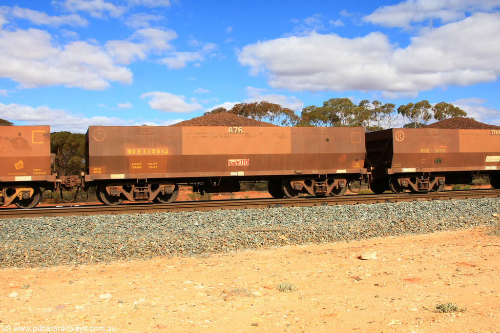 100731 02861
WOE type iron ore waggon WOE 31091 is one of a batch of one hundred and thirty built by Goninan WA between March and August 2001 with serial number 950092-081 and fleet number 676 for Koolyanobbing iron ore operations, on loaded train 7415 at Binduli Triangle, 31st July 2010.
Keywords: WOE-type;WOE31091;Goninan-WA;950092-081;