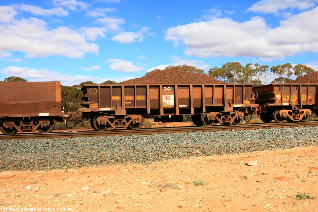 100731 02875
WOD type iron ore waggon WOD 31466 is one of a batch of sixty two built by Goninan WA between April and August 2000 with serial number 950086-038 and fleet number 529 for Koolyanobbing iron ore operations with a 75 ton capacity for Portman Mining to cart their Koolyanobbing iron ore to Esperance, now with PORTMAN painted out, on loaded train 7415 at Binduli Triangle, 31st July 2010.
Keywords: WOD-type;WOD31466;Goninan-WA;950086-038;