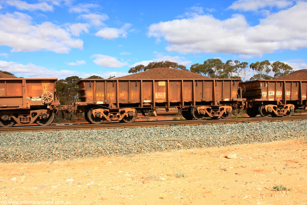 100731 02881
WOA type iron ore waggon WOA 31339 is one of a batch of thirty nine built by WAGR Midland Workshops between 1970 and 1971 with fleet number 217 for Koolyanobbing iron ore operations, with a 75 ton and 1018 ft³ capacity, on loaded train 7415 at Binduli Triangle, 31st July 2010.
Keywords: WOA-type;WOA31339;WAGR-Midland-WS;