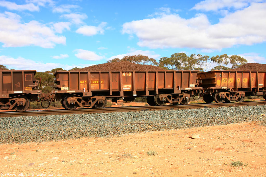 100731 02885
WOC type iron ore waggon WOC 31355 is one of a batch of thirty built by Goninan WA between October 1997 to January 1998 with fleet number 415 for Koolyanobbing iron ore operations with a 75 ton capacity, on loaded train 7415 at Binduli Triangle, 31st July 2010.
Keywords: WOC-type;WOC31355;Goninan-WA;