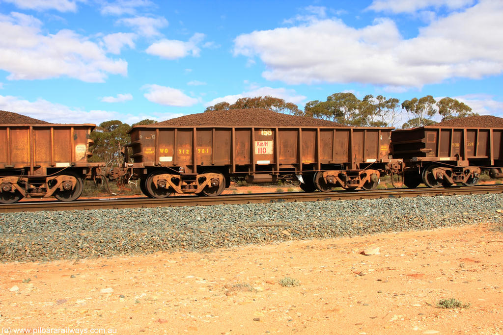 100731 02887
WO type iron ore waggon WO 31278 is one of a batch of eighty six built by WAGR Midland Workshops between 1967 and March 1968 with fleet number 158 for Koolyanobbing iron ore operations, with a 75 ton and 1018 ft³ capacity, on loaded train 7415 at Binduli Triangle, 31st July 2010. This unit was converted to WOC for coal in 1986 till 1994 when it was re-classed back to WO.
Keywords: WO-type;WO31278;WAGR-Midland-WS;