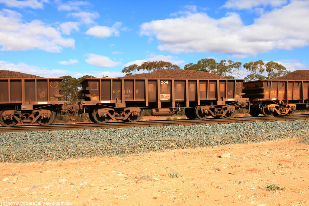 100731 02889
WOD type iron ore waggon WOD 31471 is one of a batch of sixty two built by Goninan WA between April and August 2000 with serial number 950086-043 and fleet number 534 for Koolyanobbing iron ore operations with a 75 ton capacity for Portman Mining to cart their Koolyanobbing iron ore to Esperance, now with PORTMAN painted out, on loaded train 7415 at Binduli Triangle, 31st July 2010.
Keywords: WOD-type;WOD31471;Goninan-WA;950086-043;