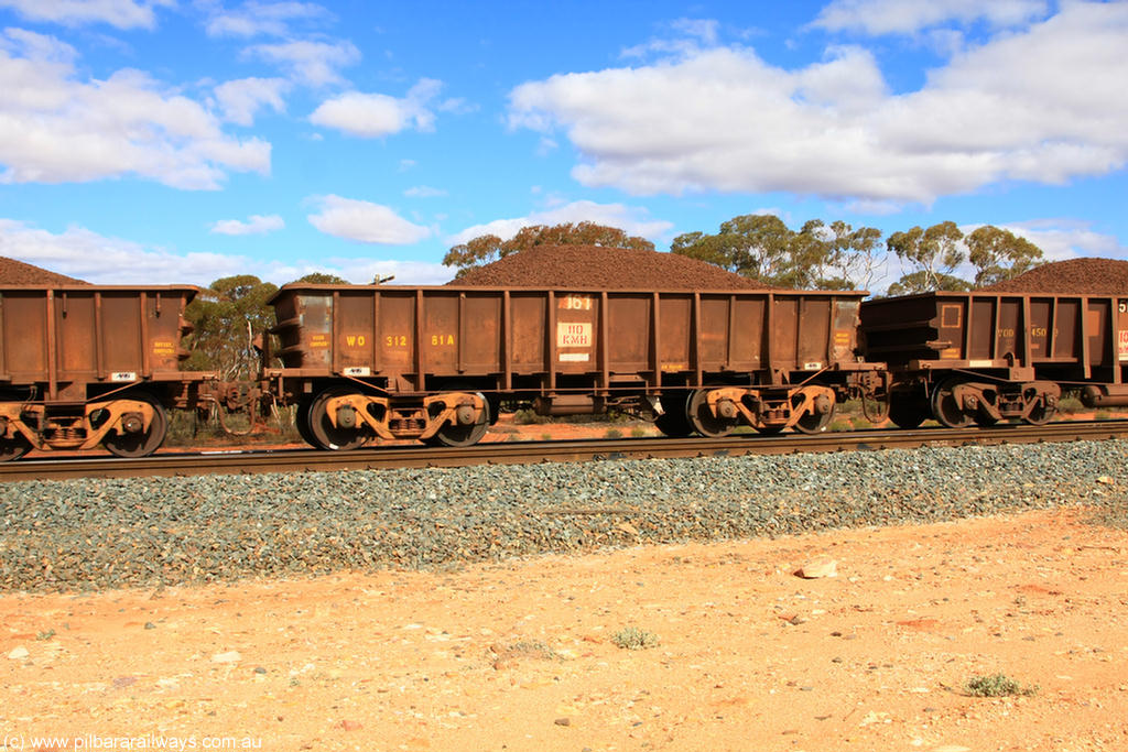 100731 02891
WO type iron ore waggon WO 31281 is one of a batch of eighty six built by WAGR Midland Workshops between 1967 and March 1968 with fleet number 161 for Koolyanobbing iron ore operations, with a 75 ton and 1018 ft³ capacity, on loaded train 7415 at Binduli Triangle, 31st July 2010. This unit was converted to WOC for coal in 1986 till 1994 when it was re-classed back to WO.
Keywords: WO-type;WO31281;WAGR-Midland-WS;