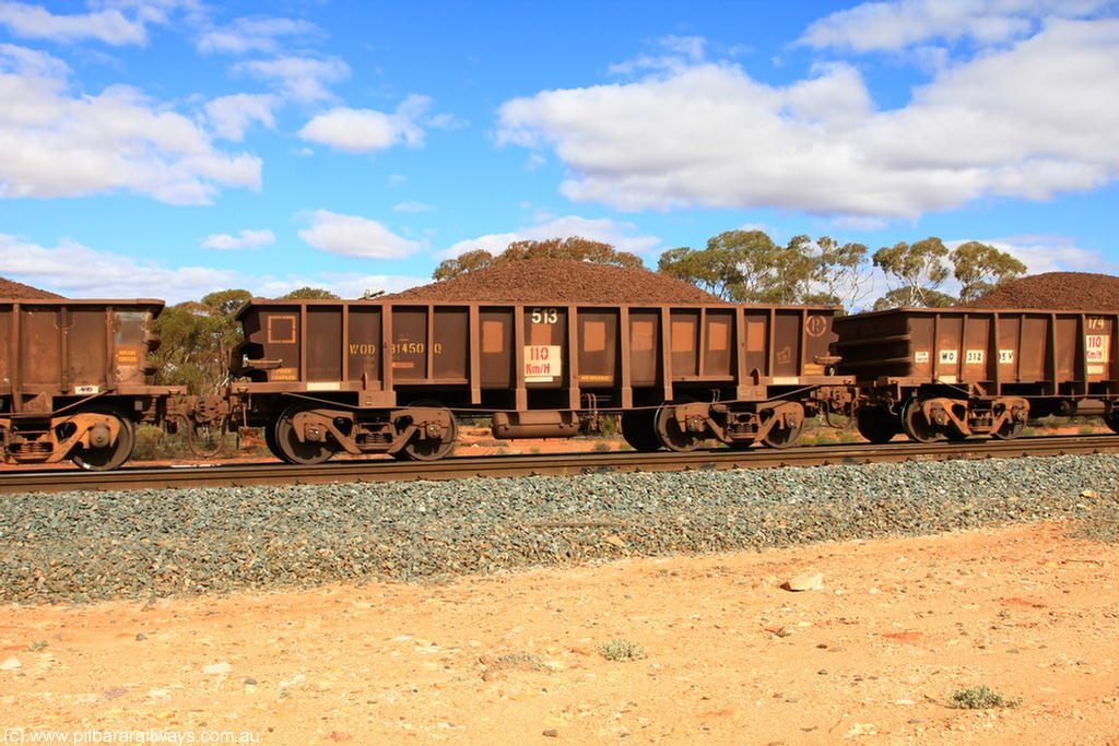 100731 02892
WOD type iron ore waggon WOD 31450 is one of a batch of sixty two built by Goninan WA between April and August 2000 with serial number 950086-022 and fleet number 513 for Koolyanobbing iron ore operations with a 75 ton capacity for Portman Mining to cart their Koolyanobbing iron ore to Esperance, now with PORTMAN painted out, on loaded train 7415 at Binduli Triangle, 31st July 2010.
Keywords: WOD-type;WOD31450;Goninan-WA;950086-022;